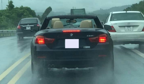 Nhìn cảnh BMW 428i mở mui bất chấp trời mưa, cư dân mạng phán "dân chơi không sợ mưa rơi" là có thật