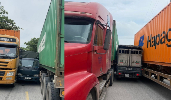 Video quay khoảnh khắc nữ tài xế lái ô tô tải vượt ẩu, bị kẹp giữa 2 xe container