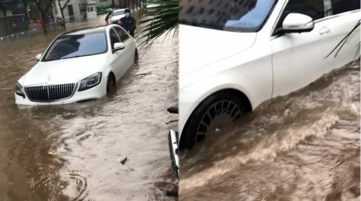 Video: Xe sang Mercedes-Benz S-Class bị "chôn chân"bởi dòng nước cuồn cuộn sau mưa lớn tại Hà Nội