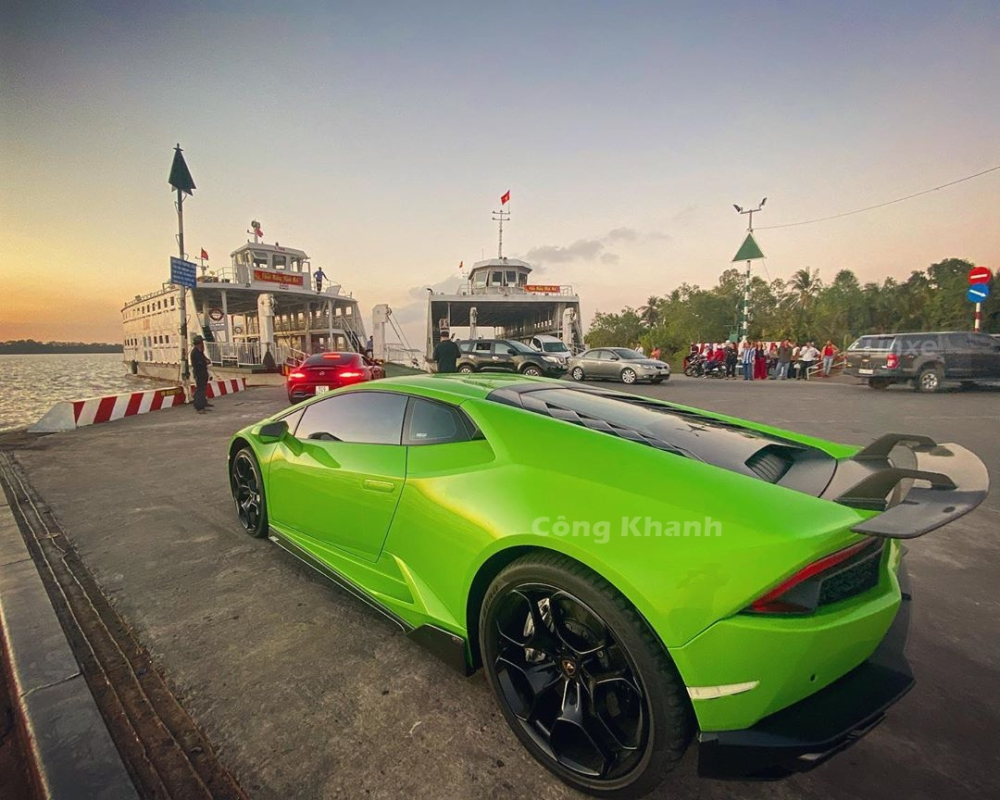Lamborghini Huracan LP610-4 in green color of Nam Dinh sea and red Mercedes-AMG GT S on the ferry in the West Lamborghini Huracan LP610-4 in green color of Nam Dinh sea and red Mercedes-AMG GT S on the ferry in the West