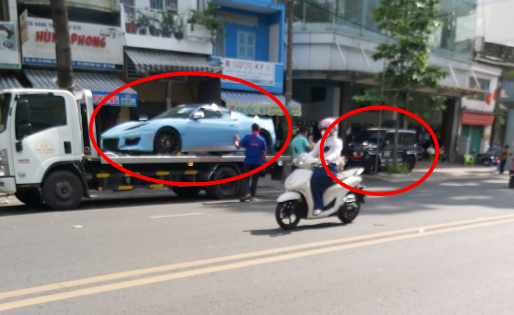 Hình ảnh xe Lotus Evora GT độc nhất Việt Nam lên xe chuyên dụng trong ngày Minh Hình ảnh xe Lotus Evora GT độc nhất Việt Nam lên xe chuyên dụng trong ngày Minh Nhựa thăm showroom bán xe của bạn, phía sau là chiếc Mercedes-AMG G63 Edition 1
