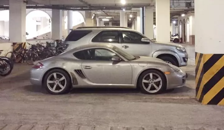 Porsche Cayman covered in dust