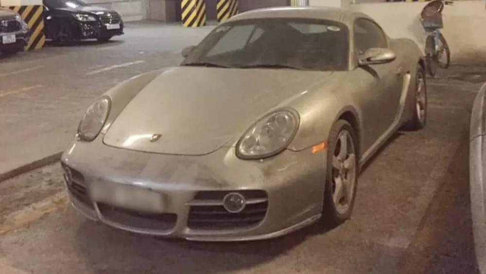 Close-up of the dusty Porsche Cayman