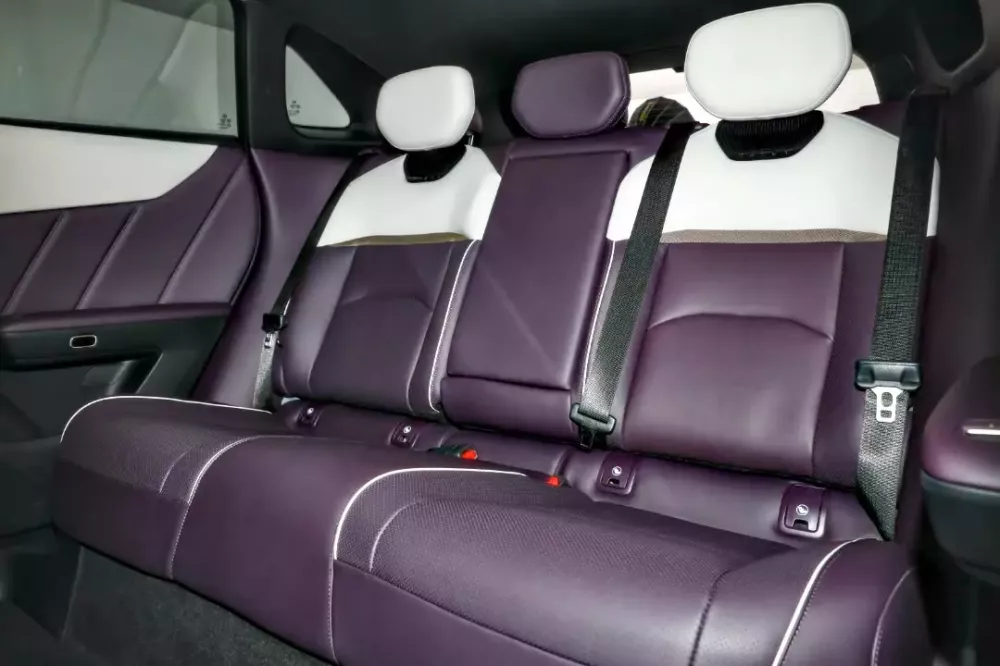 The rear seats of the Mazda EZ-60 offer ample legroom and comfort.
