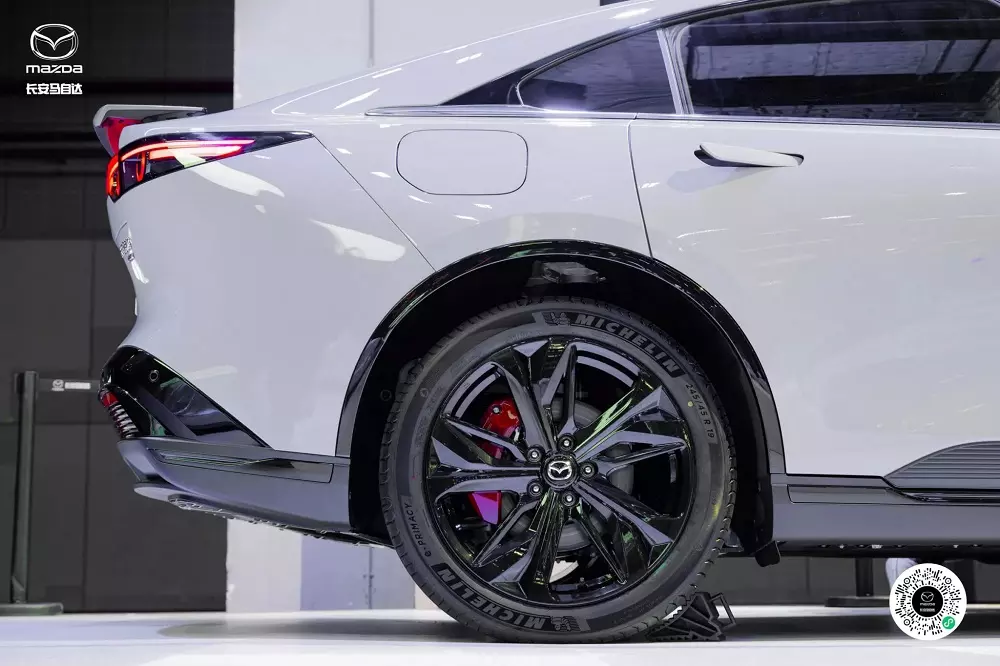 Close-up of the wheels and red brake calipers