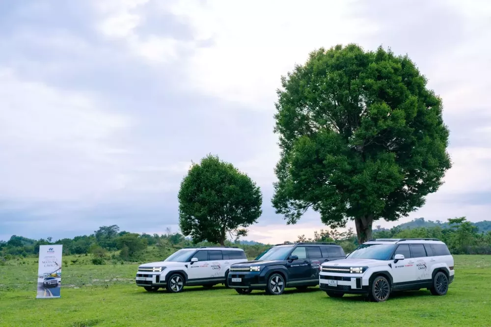 Hyundai Santa Fe on a road with a scenic backdrop